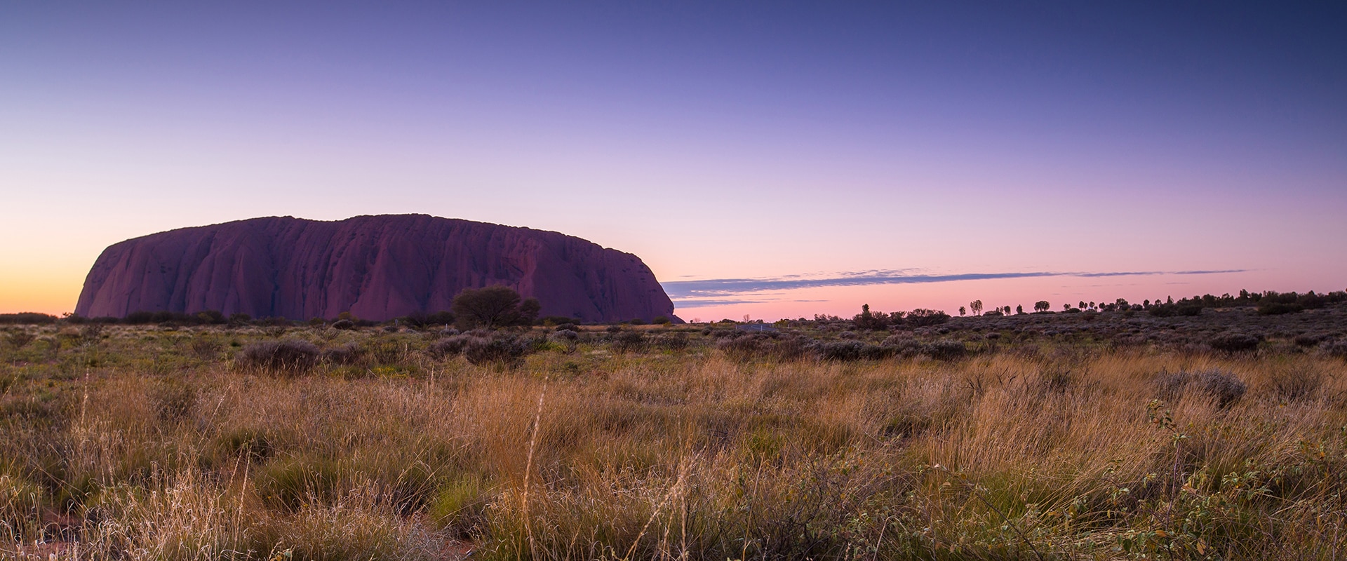 Ayers Rock at Sunset with a purple sky, Northern Territory