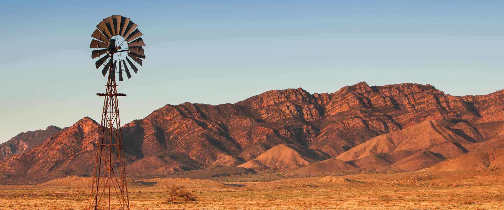 Flinders Ranges with windmill in foreground, South Australia.