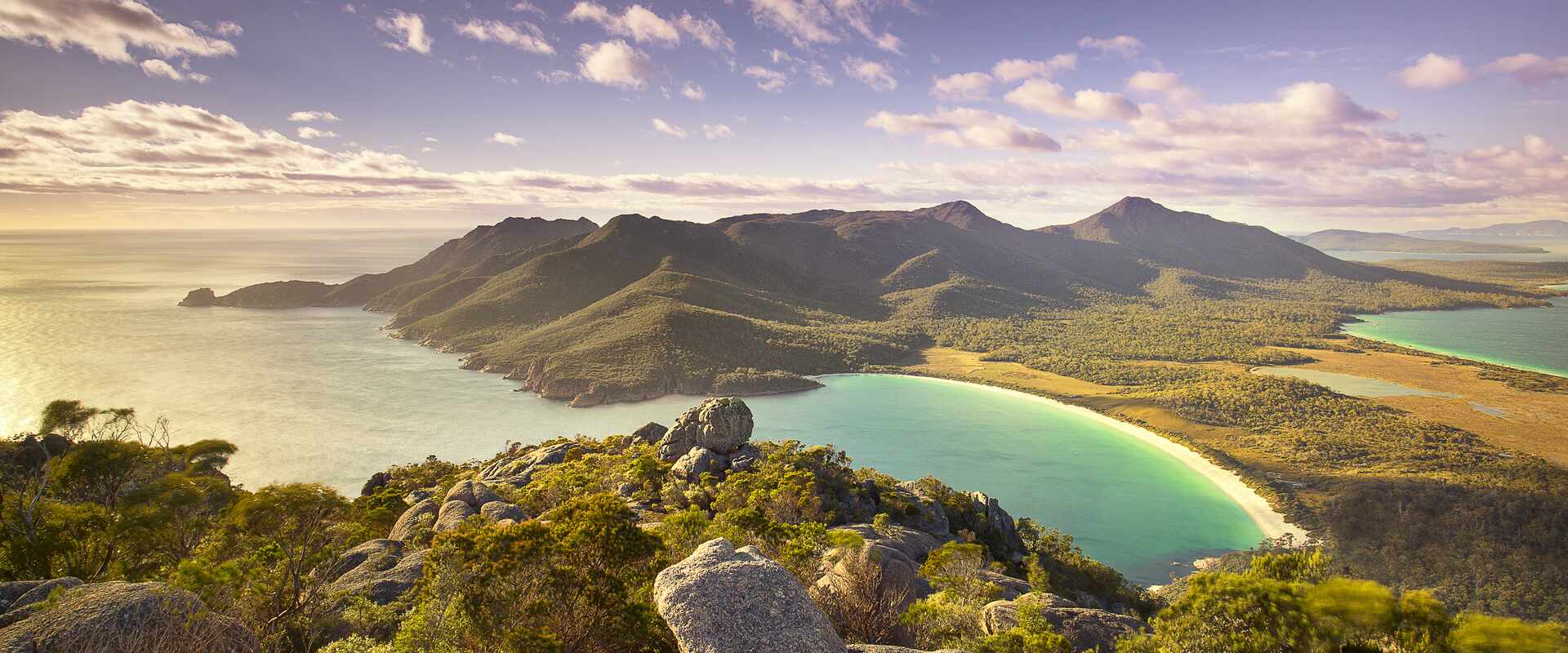 Aerial view over the mountains and pristine beach of Wineglass Bay