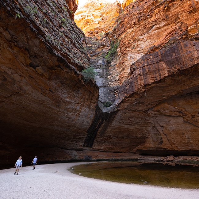 Couple walking through Cathedral Gorge, Kimberley