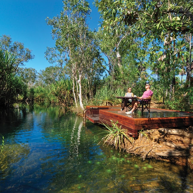Mitchell Falls Wilderness Lodge, Waterhole with couples on deck