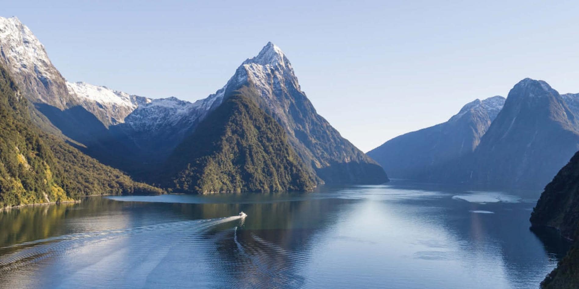 Long distance view of Milford Sound depicting the mountains