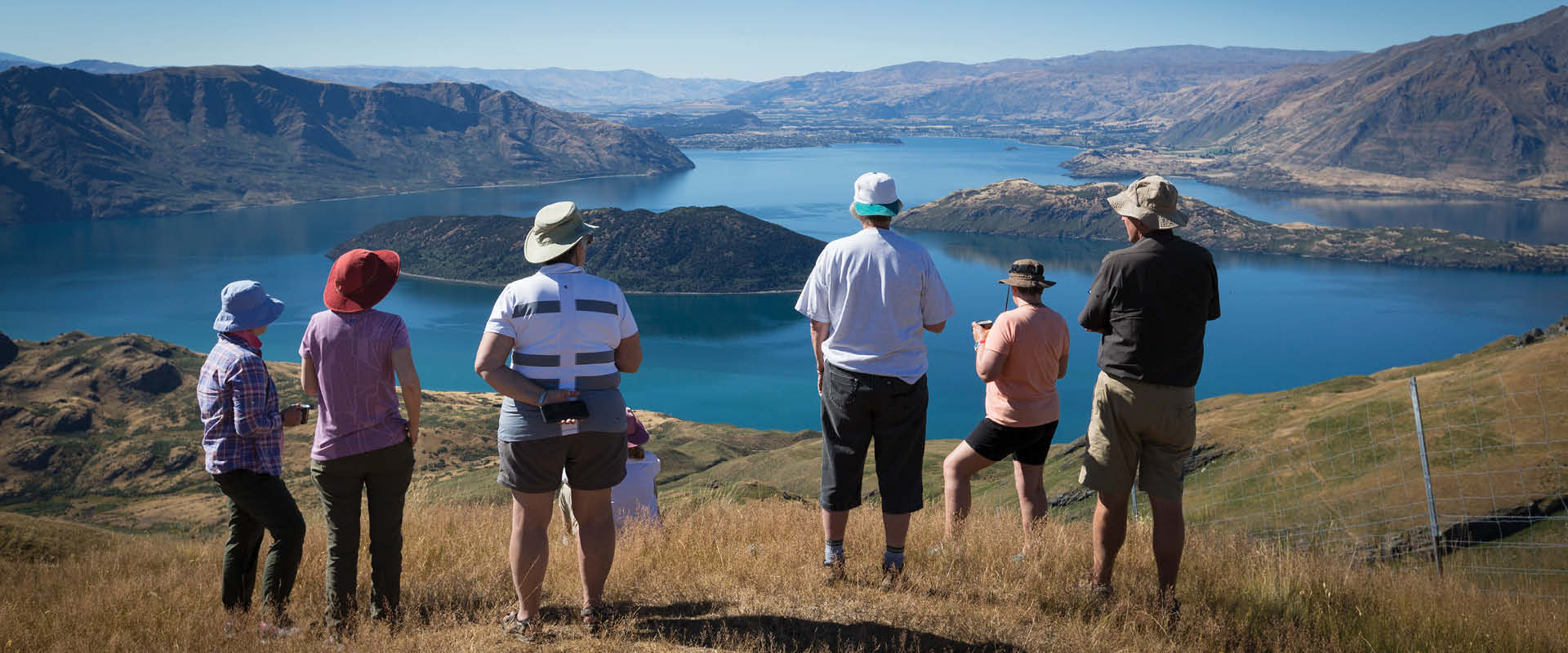A group of travellers enjoying the view of Wanaka