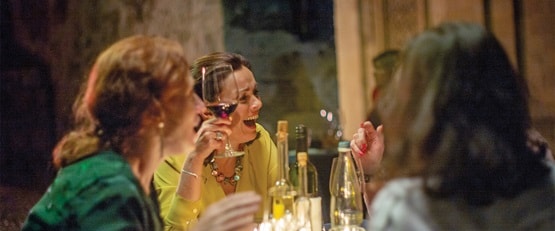 Ladies drinking wine at dinner