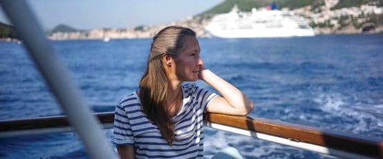 Woman sitting on board a ship, Croatia