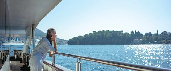 Woman standing on deck, MV Queen Eleganza