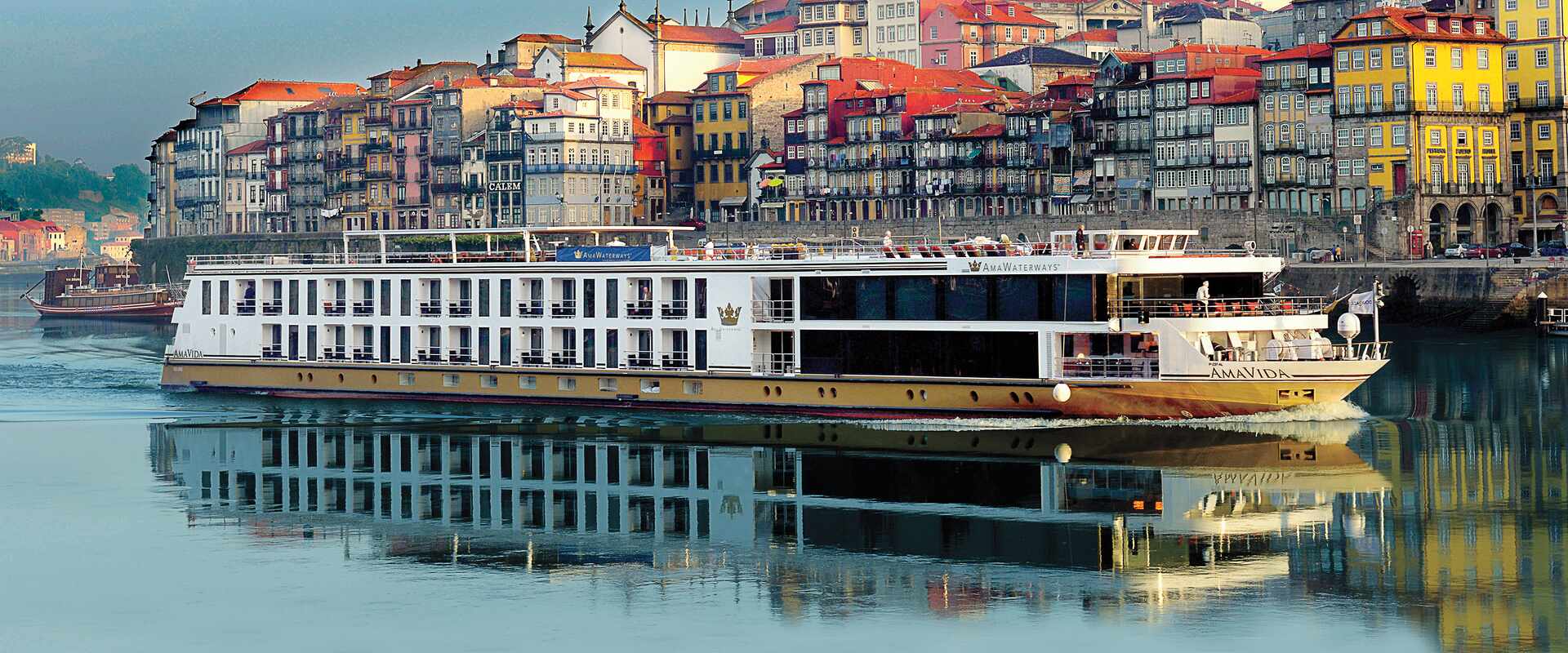 The ms Ama Vida sailing along the Douro River past village, Portugal