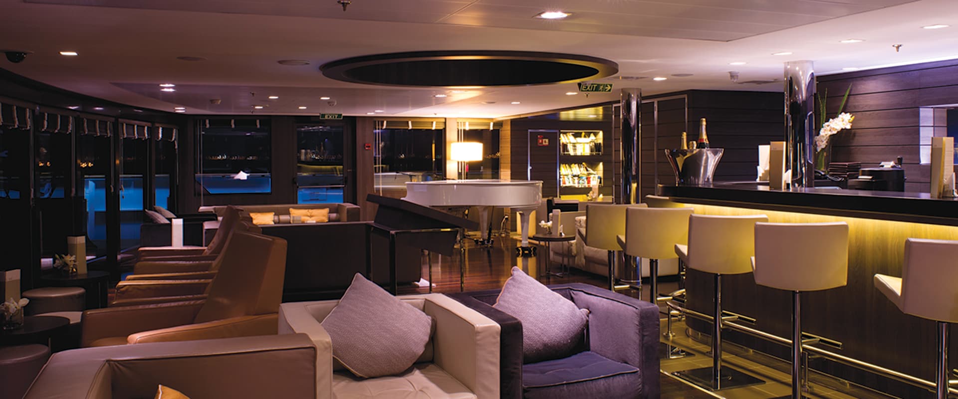 Cocktail bar with lounges and bar stools on a ship
