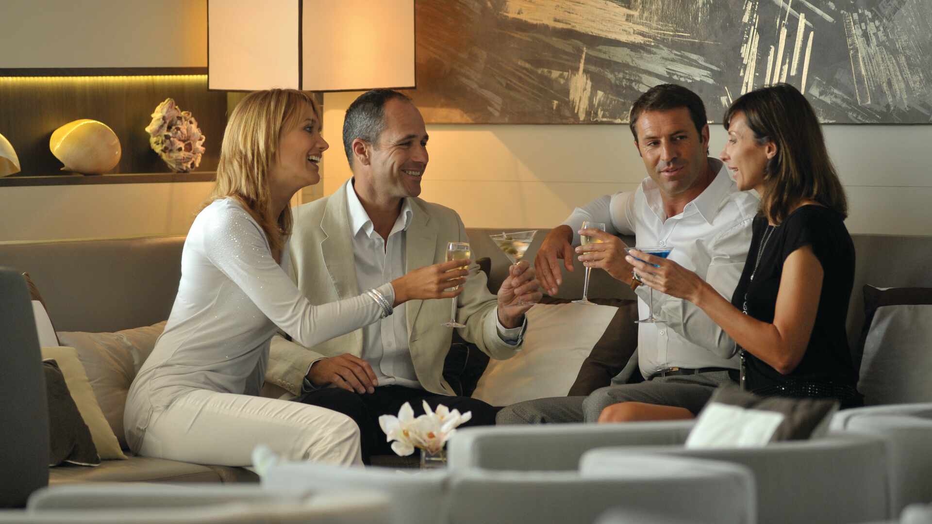 Passengers sharing drinks in lounge, Le Boreal