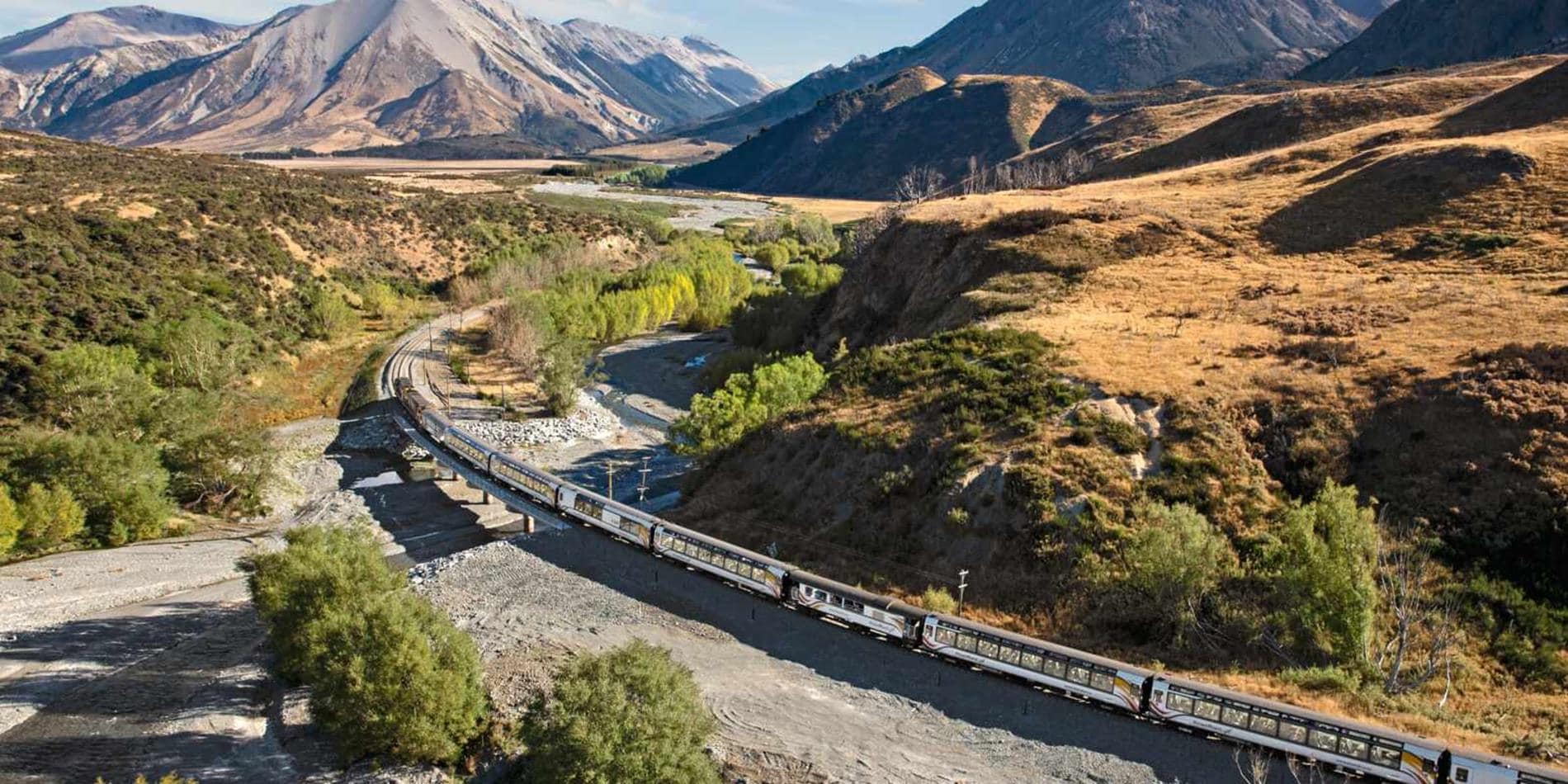 View of Tranzalpine train through hillside, New Zealand