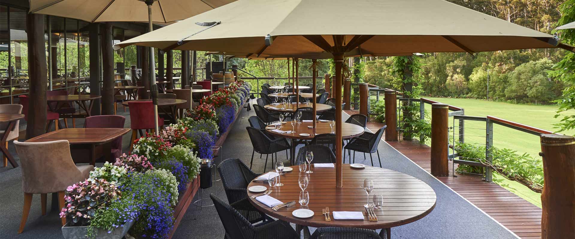 verandah and tables at leeuwin estate flowers umbrellas western australia