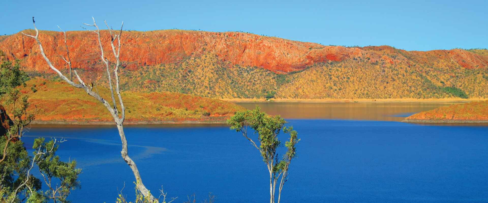 View of blue lake infront of red and green landscape, Western Australia