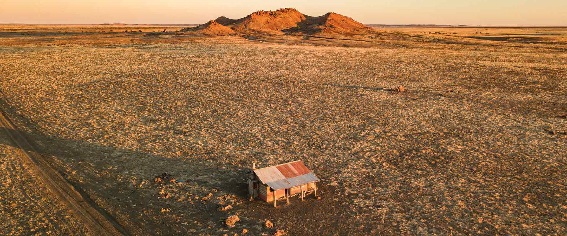 winton aerial landscape hut rocky mesa sunset